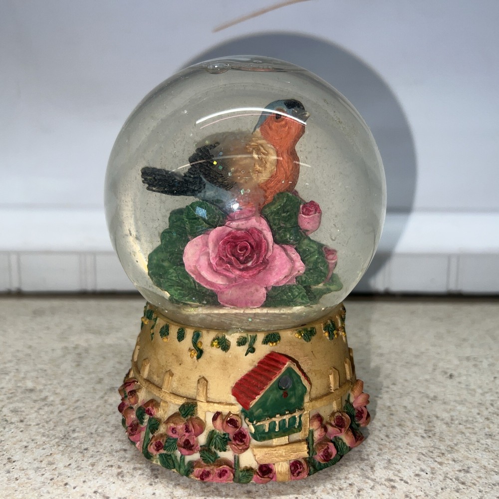 Vintage bird snow globe