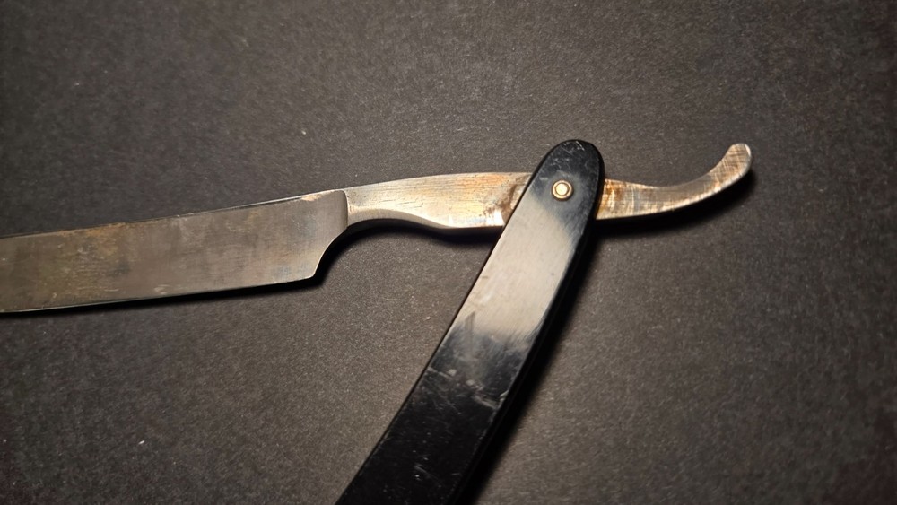 Vintage, old antique Straight Razor with fish