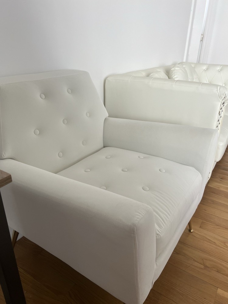 White quilted fabric armchair