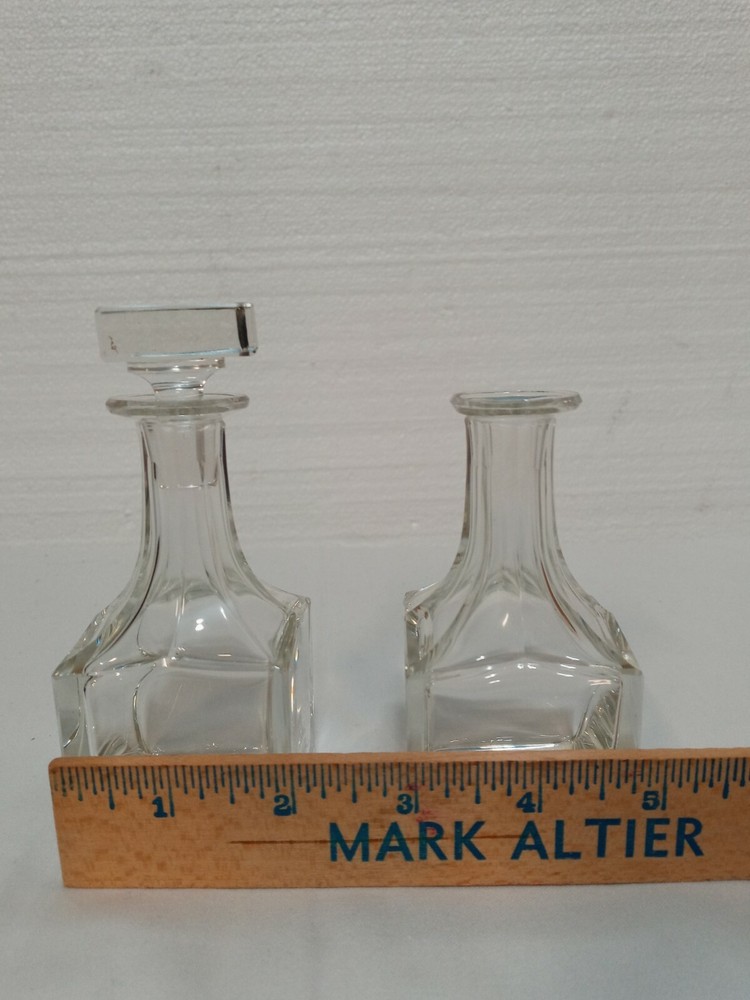 Two 4in Clear Glass Bottles One Stopper