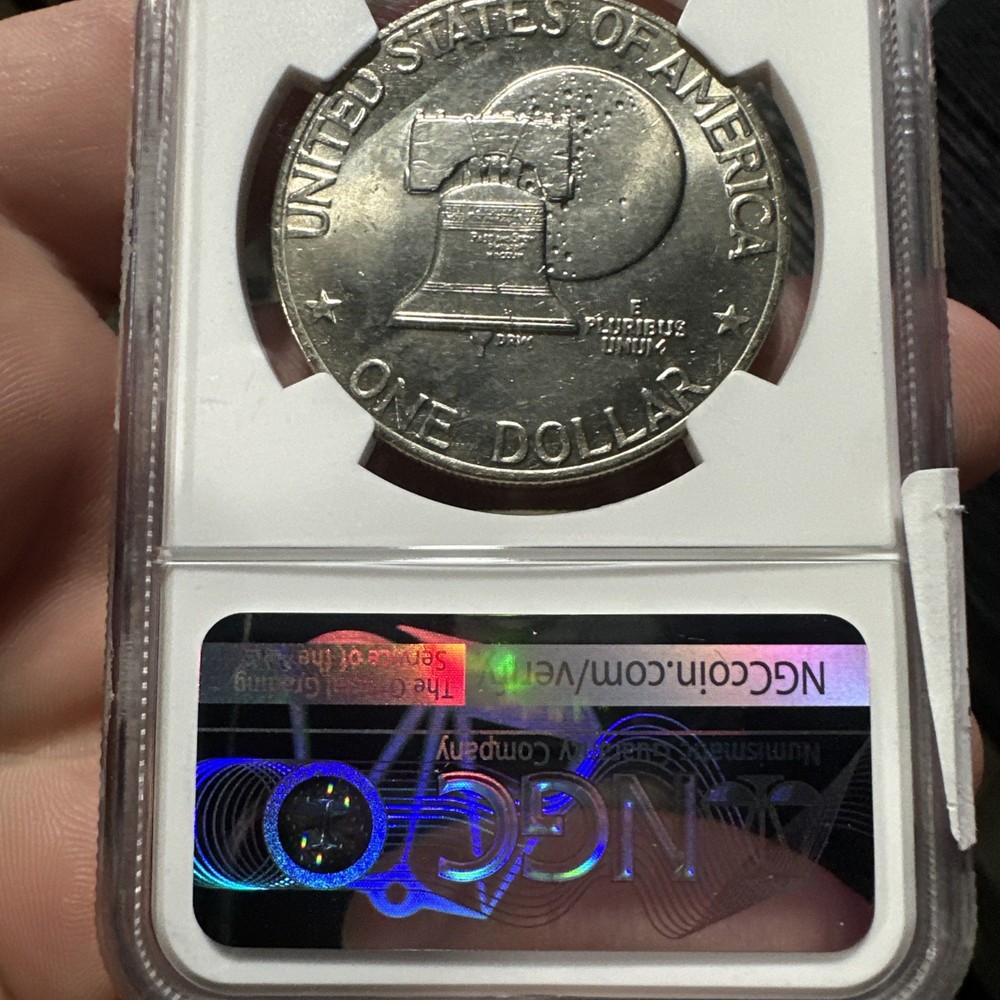 Nice Toned Eisenhower Dollar with peg leg NGC Graded