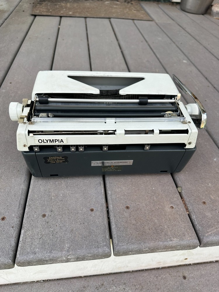 Olympia SM9 Portable Typewriter with case