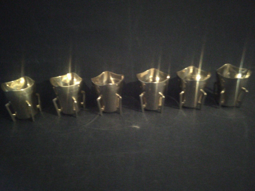A Set Of 6 Silver Mether Cups.