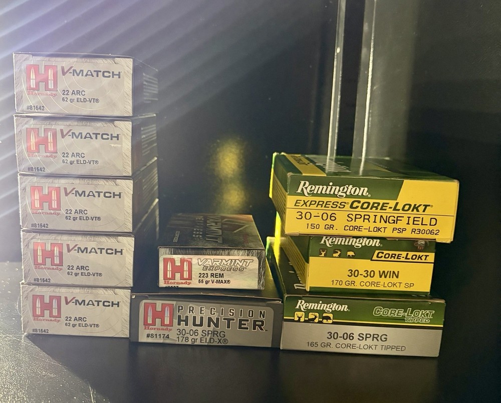 Various empty cardboard ammo boxes.