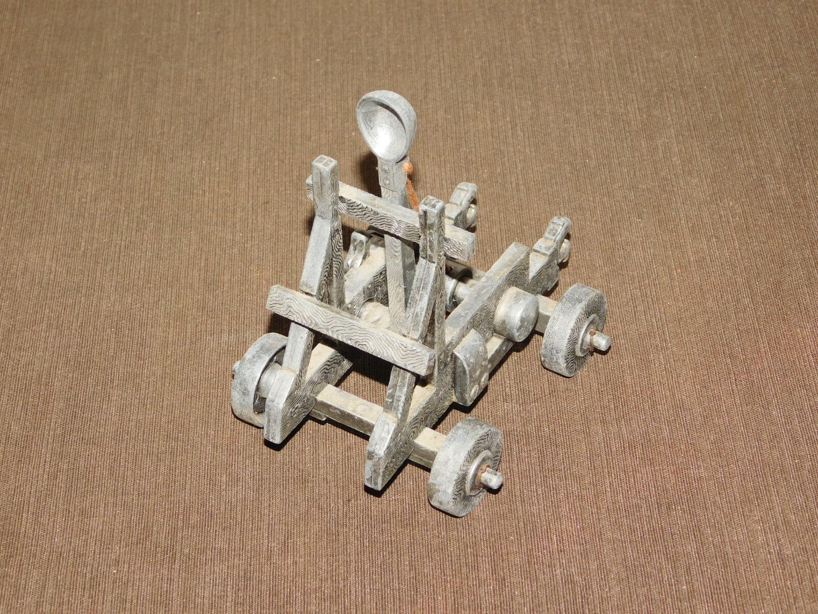 VINTAGE TOY 5" X 4" X 5 1/2" HIGH METAL CATAPULT