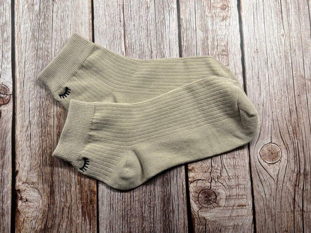 Socks with embroidered lashes