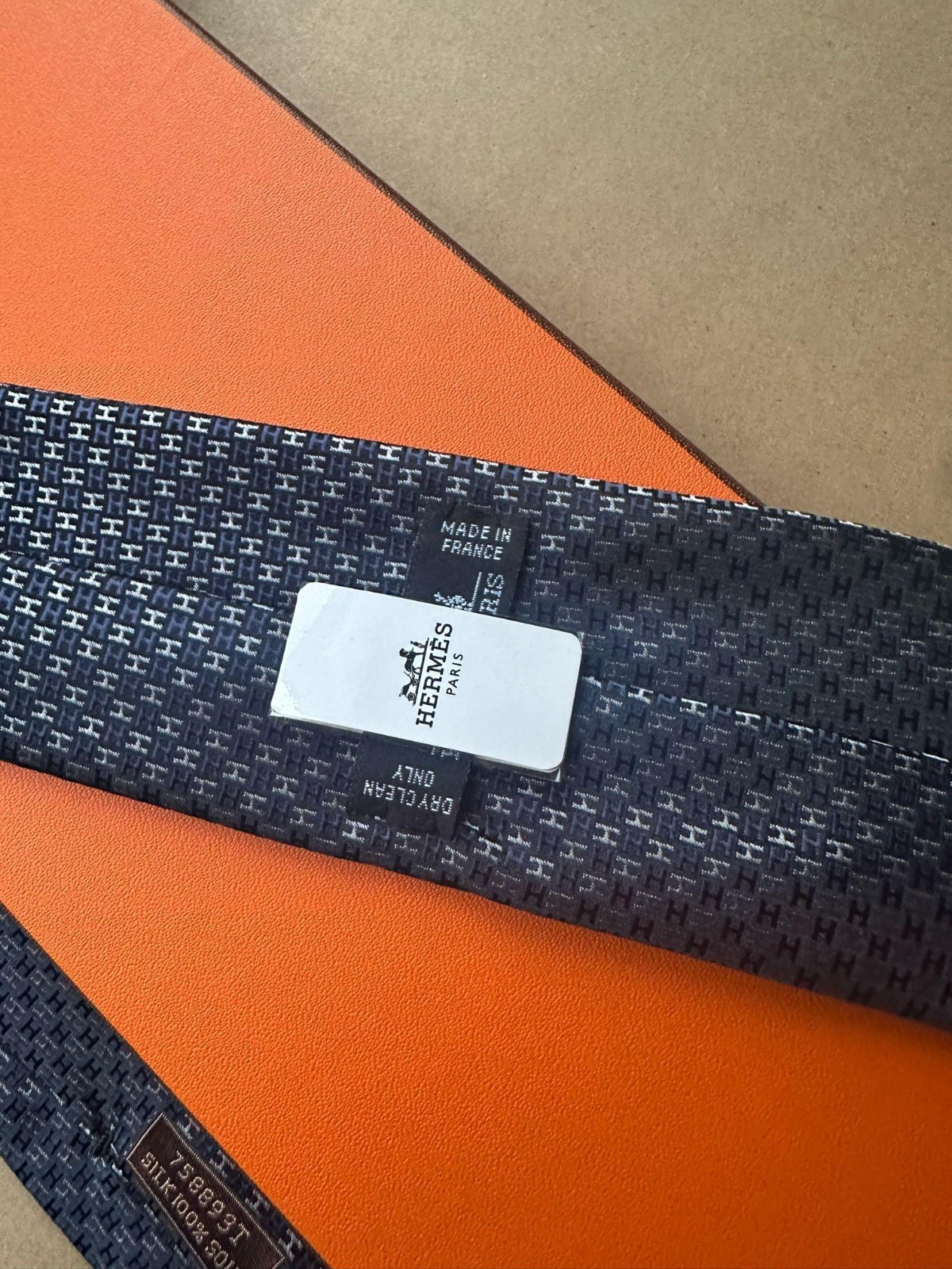 HERMES BLUE SILK TIE -- ALL OVER H MONOGRAM JACQUARD