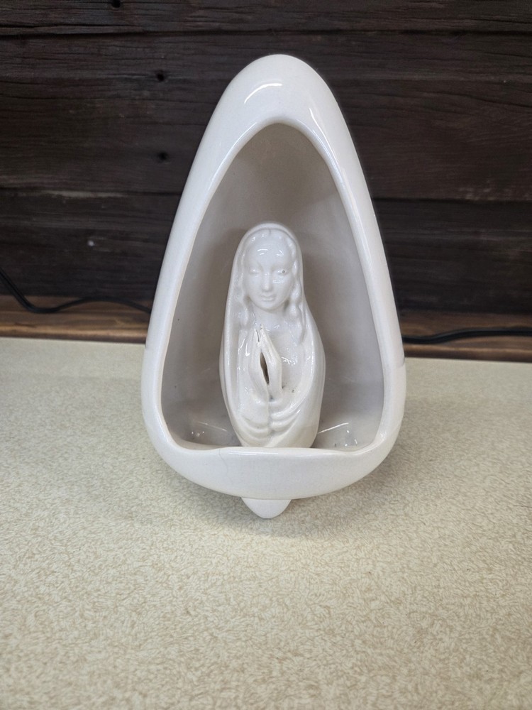 CERAMIC PRAYING MADONNA IN EGG SHELL FIGURINE.