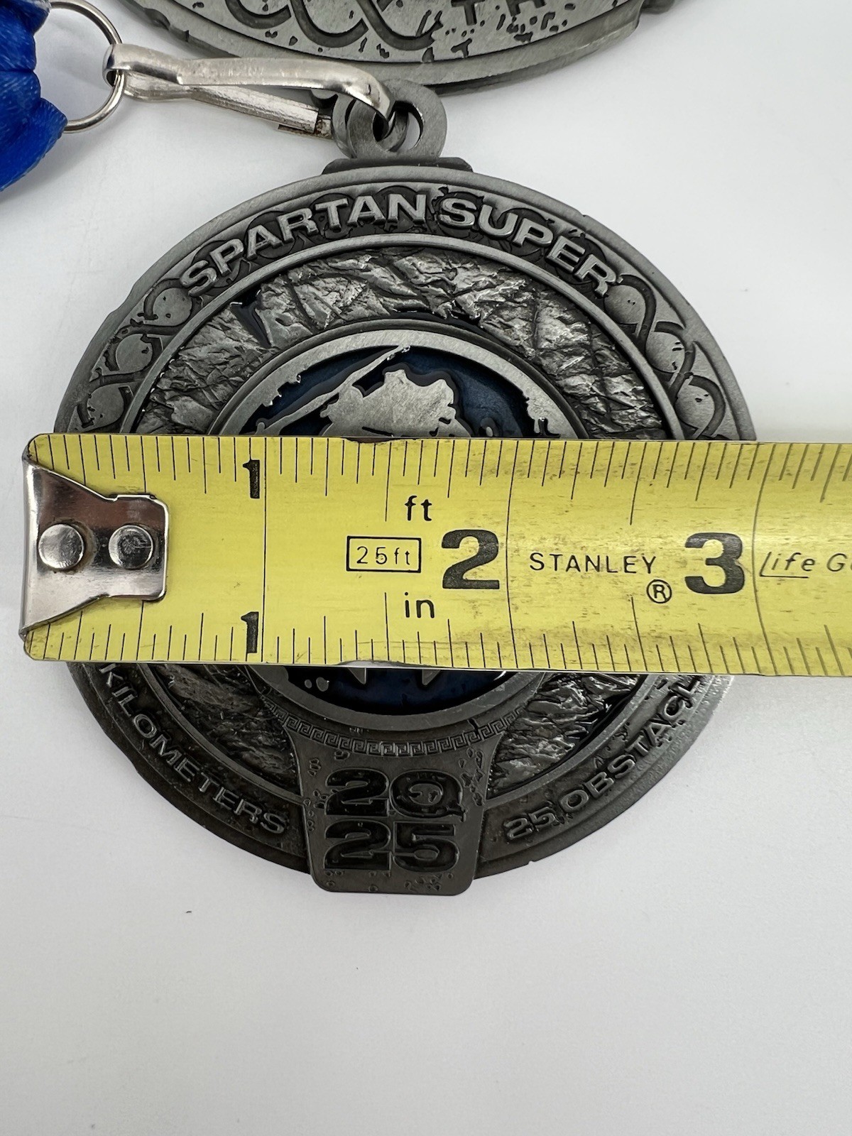 Spartan Super 2025 Finisher Medal Silver Blue 10 Kilometers 25 Obstacles