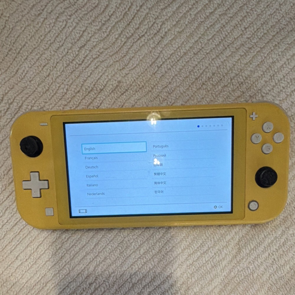 Nintendo Switch Lite Yellow Console Bundle w/ Super Smash Bros Ultimate & Mario…