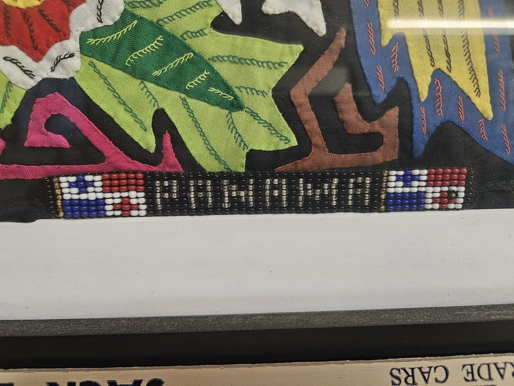 Authentic Mola Art Depicting A Parrot