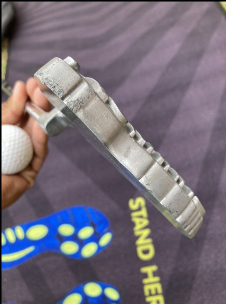 Brooks golf putter with putting mat