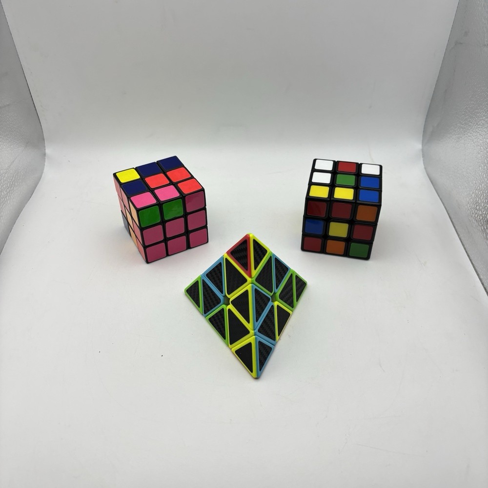 2 - Rubiks Cubes and 1 - Pyraminx Triangle Puzzle. VG Condition.