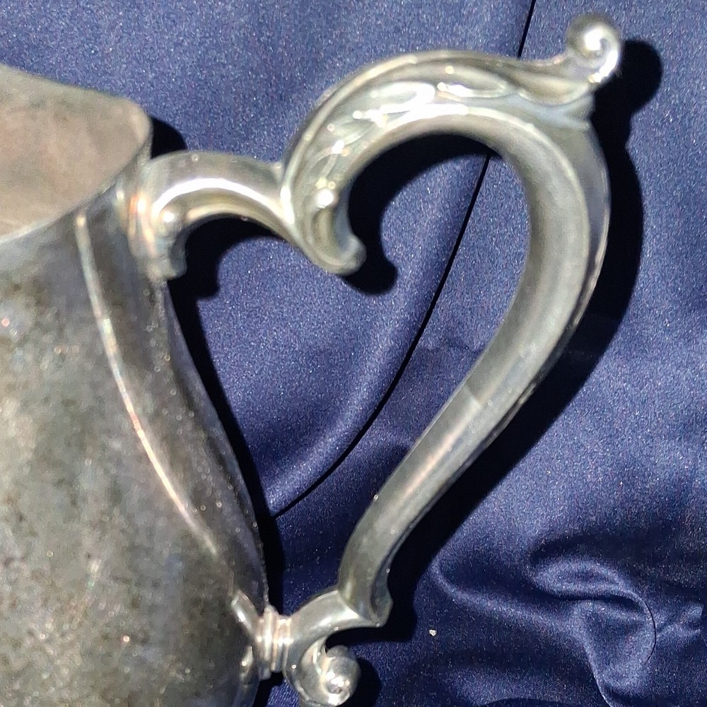 vintage Oneida silver-plated water pitcher.