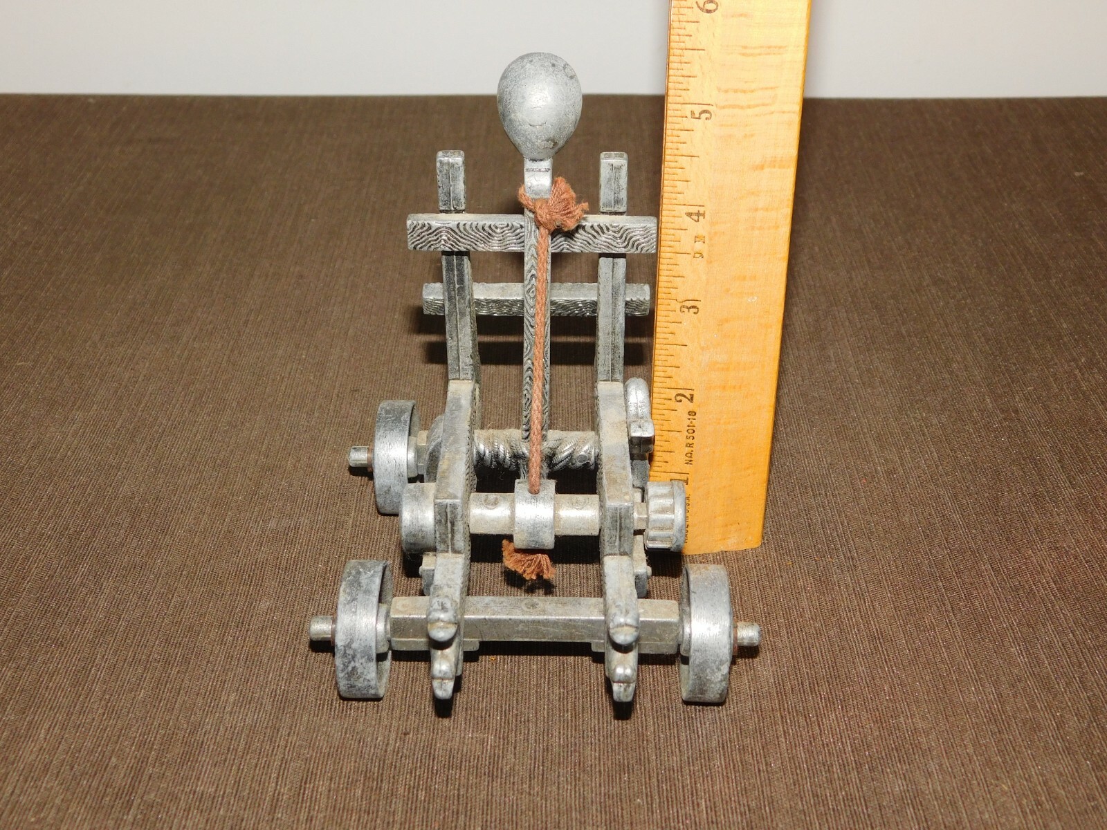 VINTAGE TOY 5" X 4" X 5 1/2" HIGH METAL CATAPULT