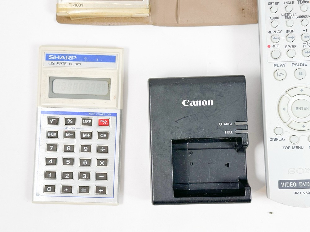 Mixed Electronics Lot TV Remotes Camera Calculators Vintage
