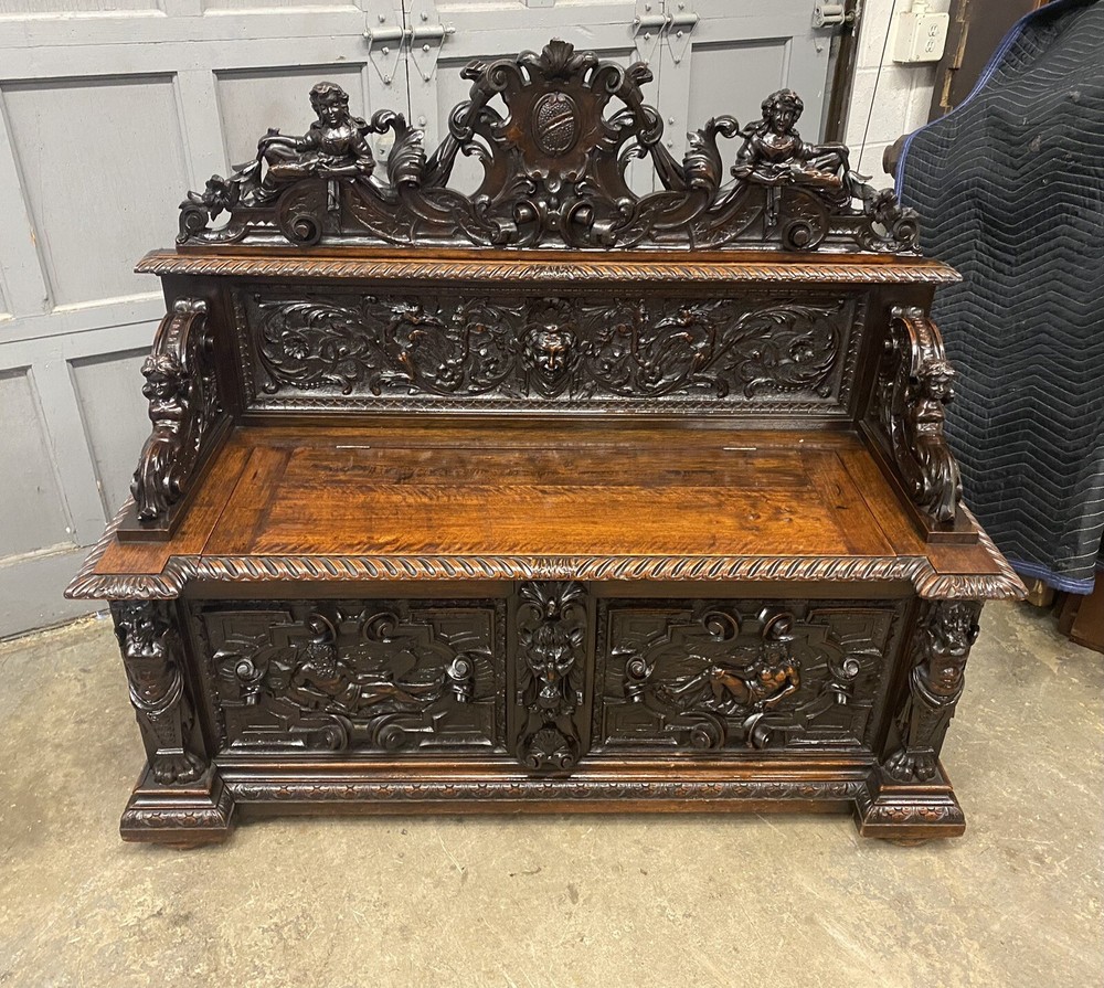 CARVED FIGURAL WALNUT BENCH