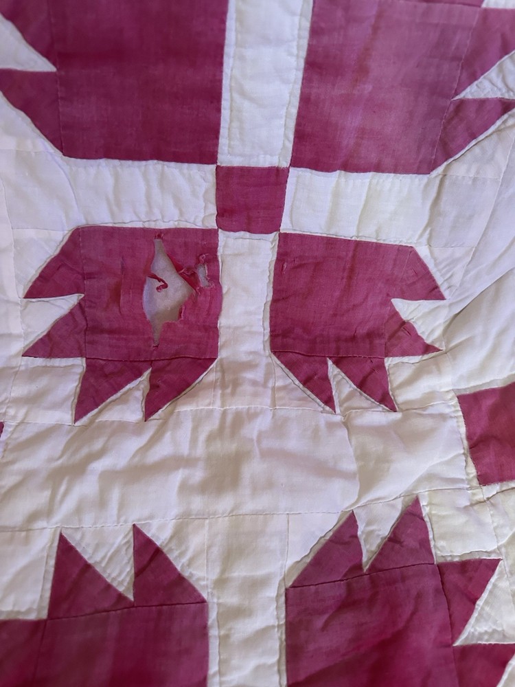 Cutters handmade red and white "Bear Paw" pattern quilt.