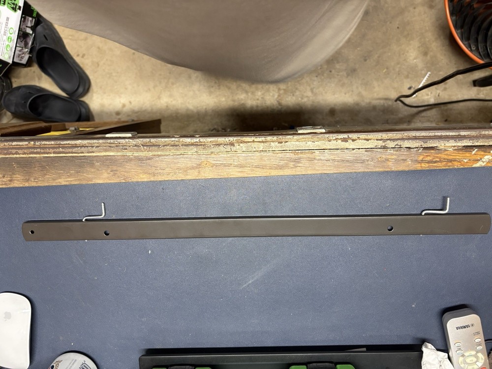 Adjustable wall rails for a Rowe 4900/5900 vending machine.
