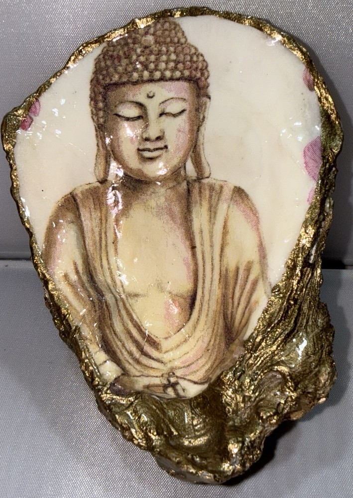 Decoupaged oyster shell ring dish featuring a Buddha image with gold-leaf edging