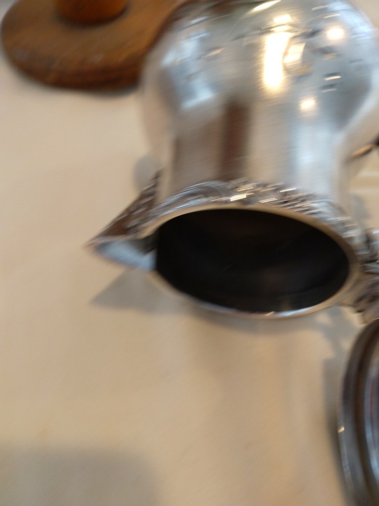 Beautiful small antique silver plated or silver pitcher.