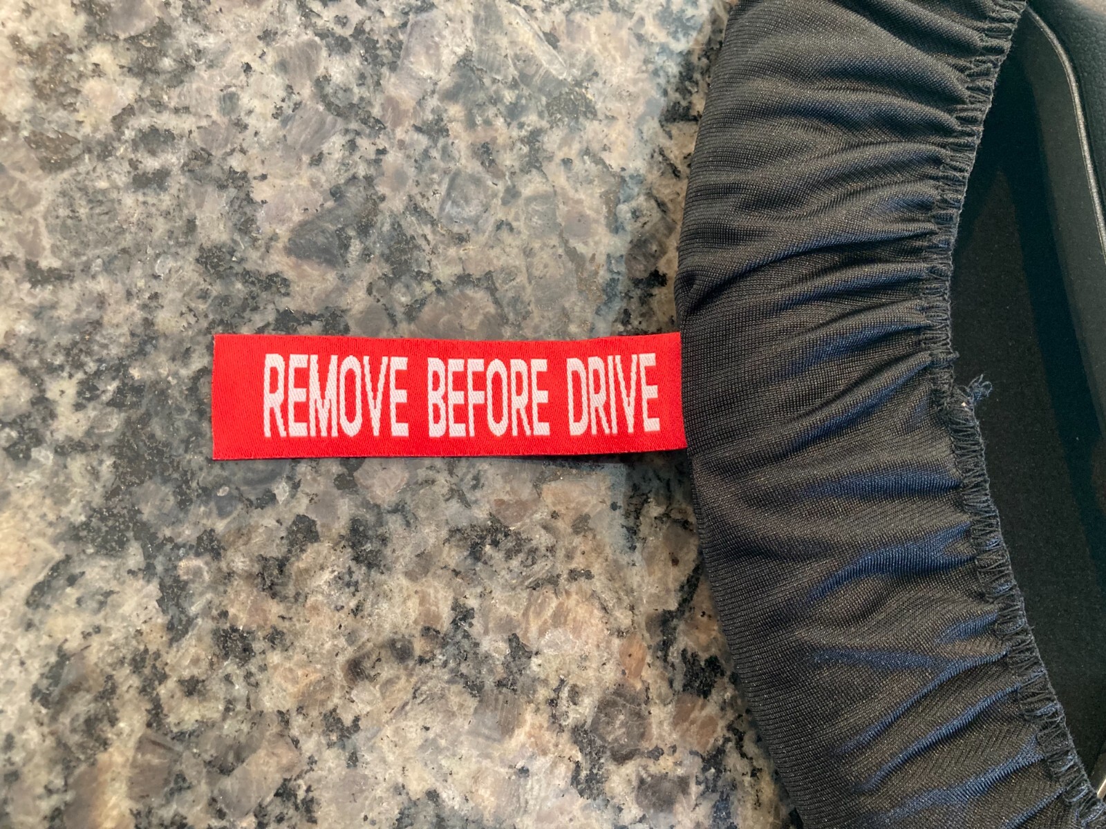 PORSCHE DESIGN OEM FACTORY STEERING WHEEL PROTECTIVE COVER IN BLACK W/CREST. NEW