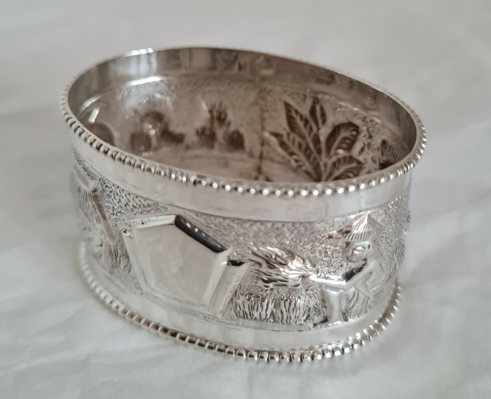 Antique oriental Napkin ring . Marked Sterling silver.