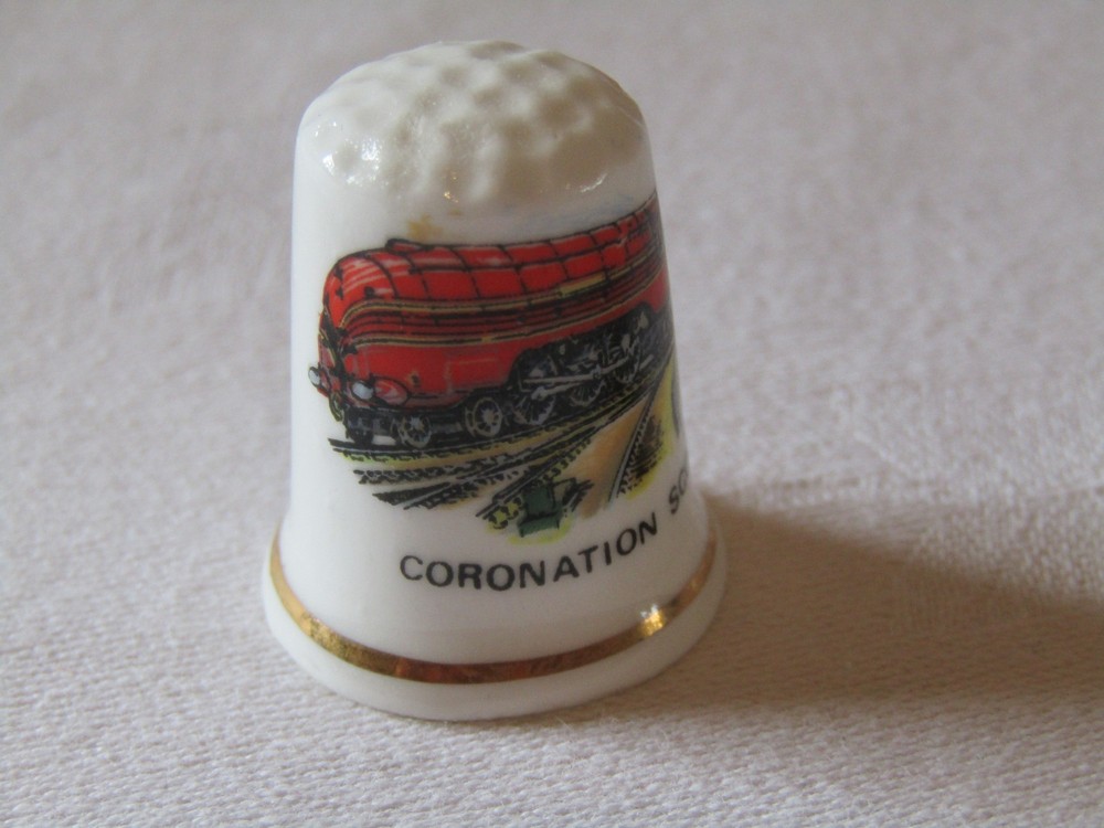 BONE CHINA THIMBLE FEATURING THE TRAIN CORONATION SCOT.
