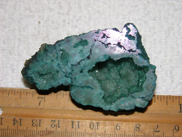Geode cut & polished half with colored crystal center 2.5 inch E19