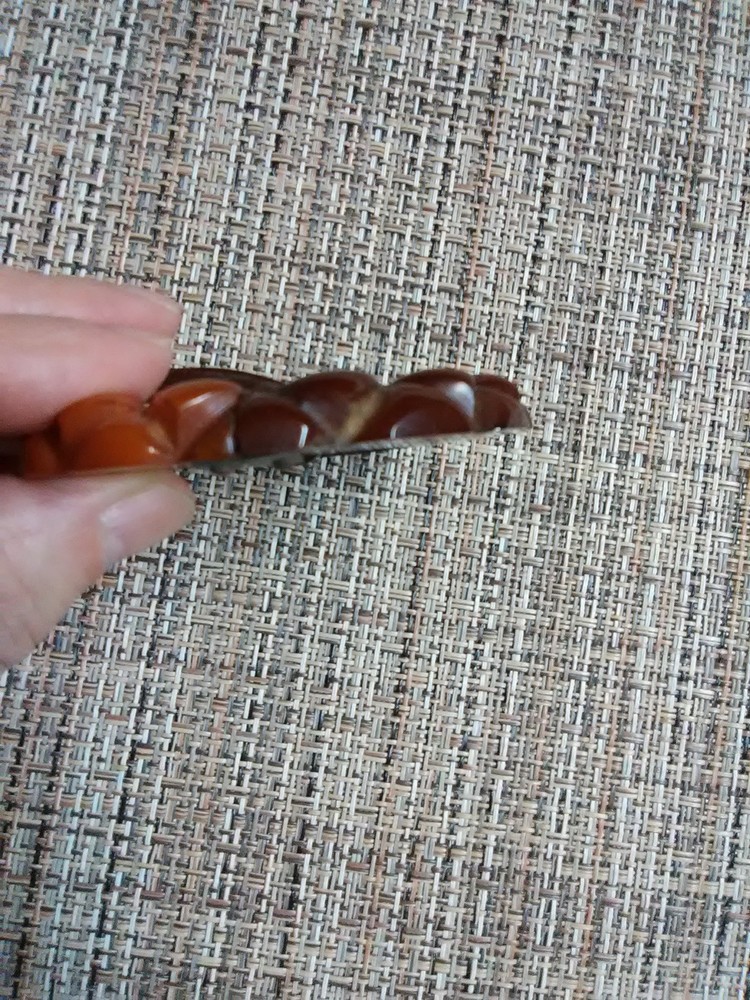 Carved Bakelite buckle