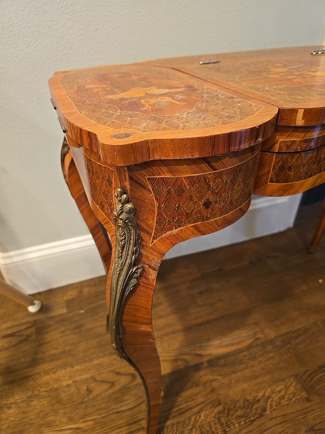 "Antique vanity table from the late 1800s with intricate inlay & a hidden mirror