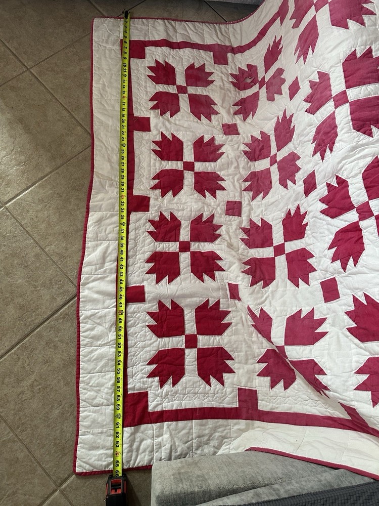 Cutters handmade red and white "Bear Paw" pattern quilt.
