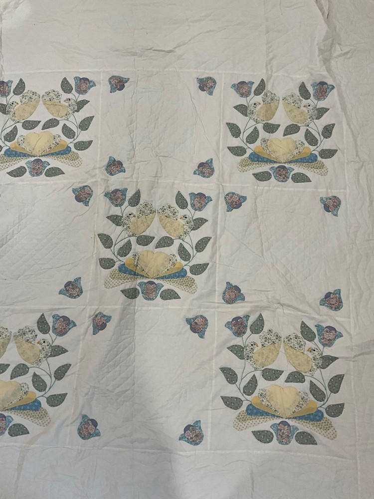 Vintage handmade quilt with birds