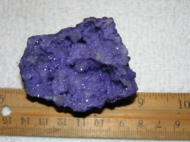 Geode cut & polished half with colored crystal center 2.5 inch E61