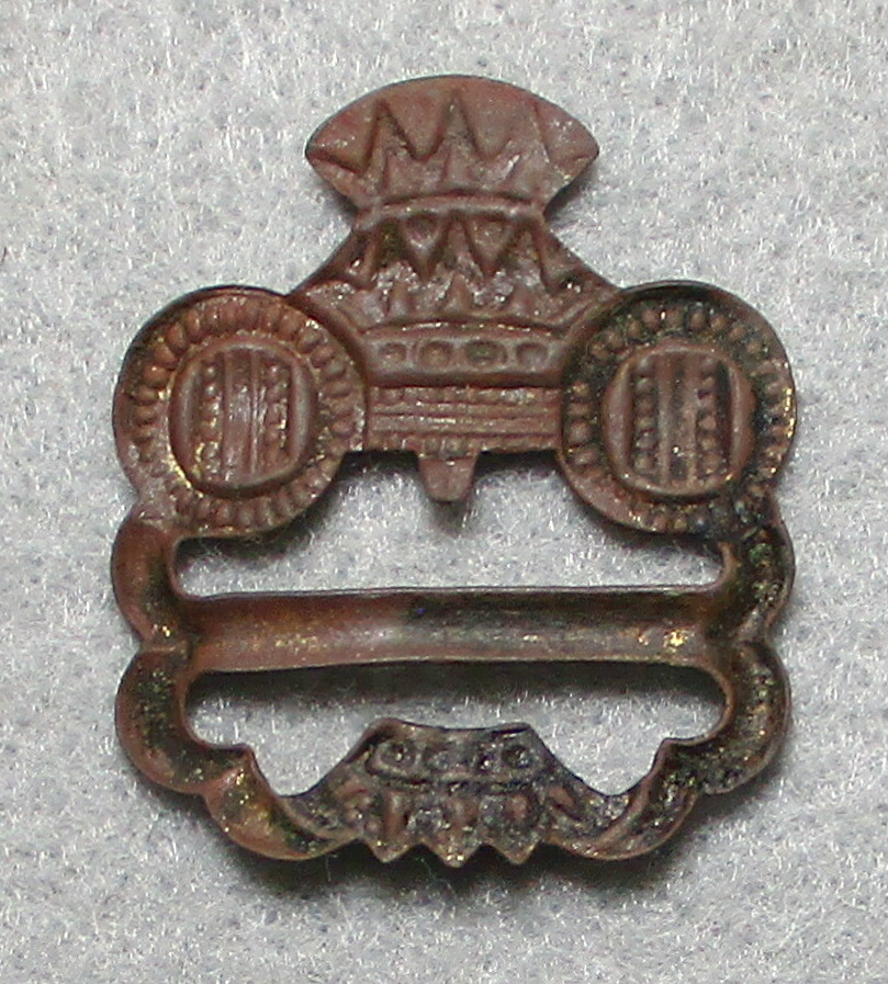 An Elegant Copper Hat Badge/Slide with a Crown & Other Heraldic symbols