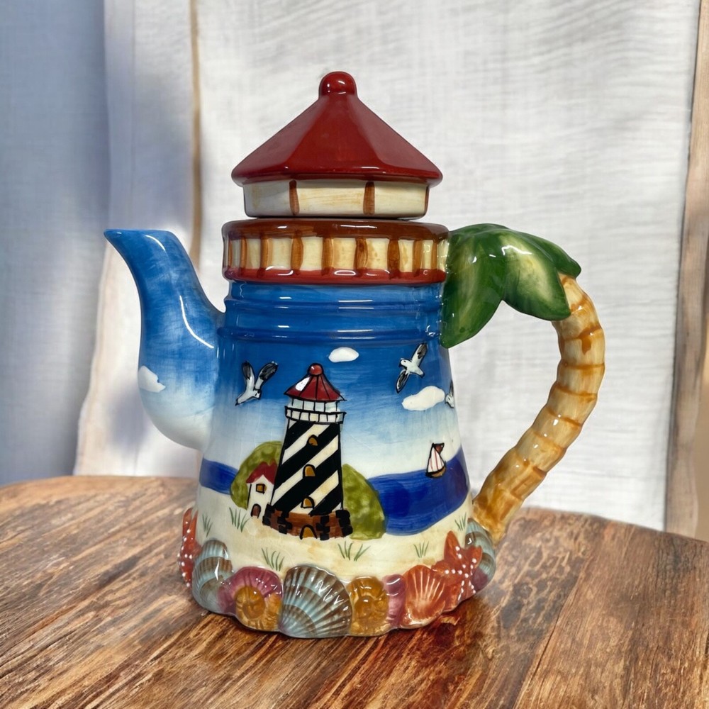 RARE Coffee Pot Lighthouse Hand painted Blue sky, Beach, Shells Palm tree Handle
