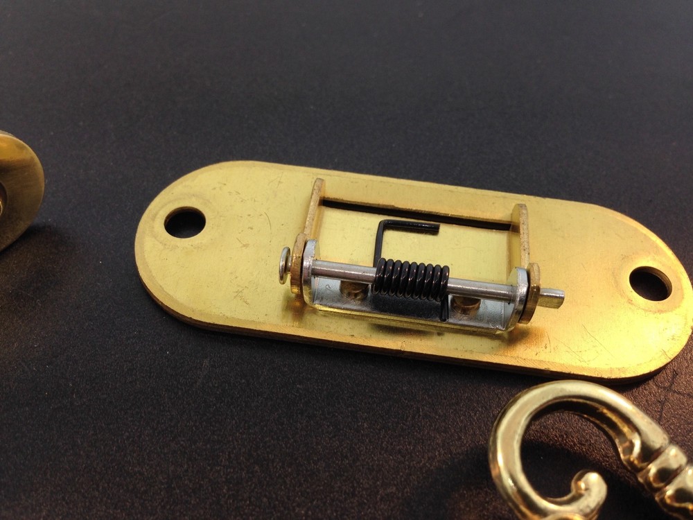 Roll-top Desk lock with self closing strike hardware