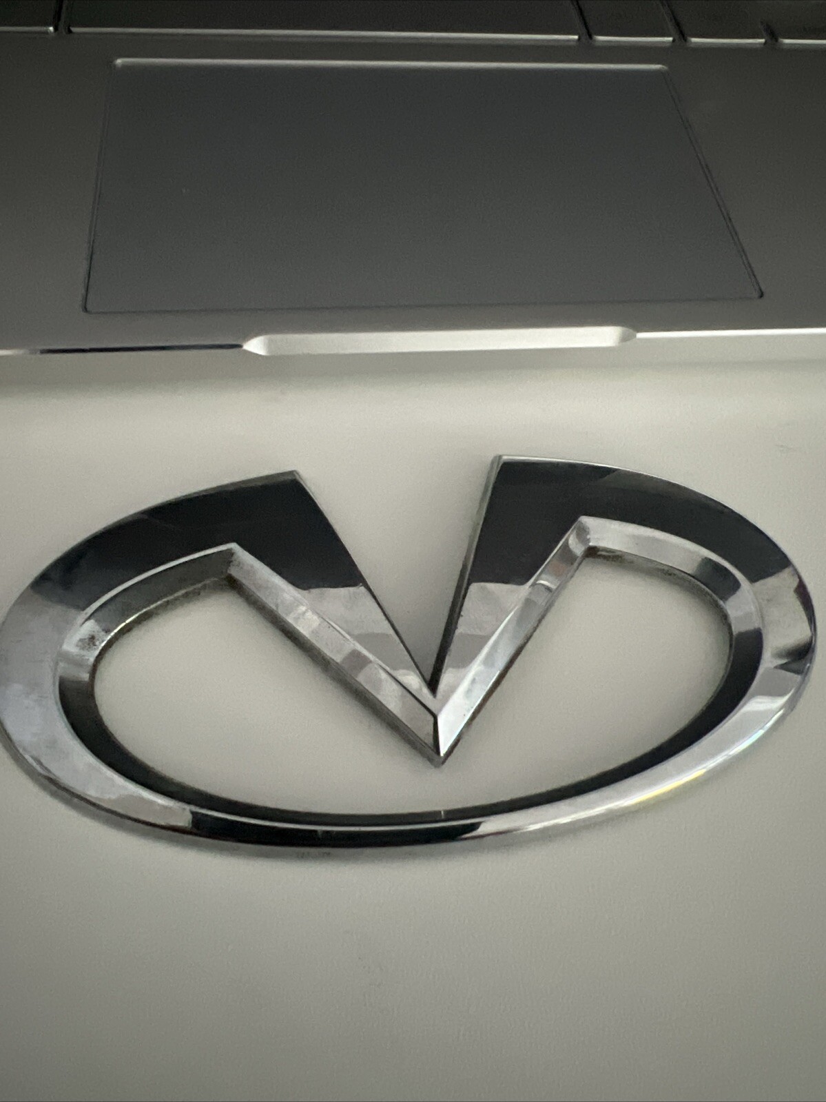 infiniti engine cover emblem