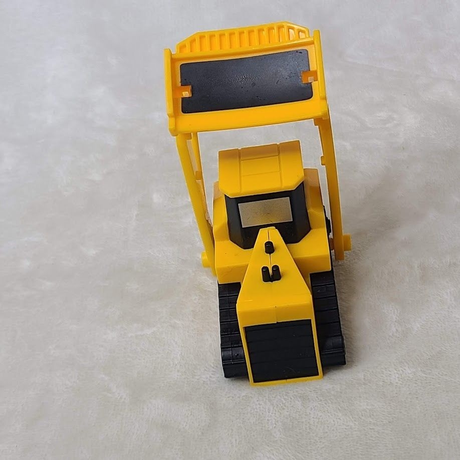 Yellow Plastic Toy Bulldozer With Movable Front Blade