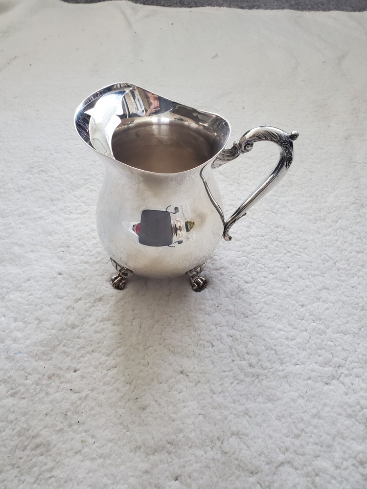 Cheeks Design &Art co. Silver plated footed pitcher