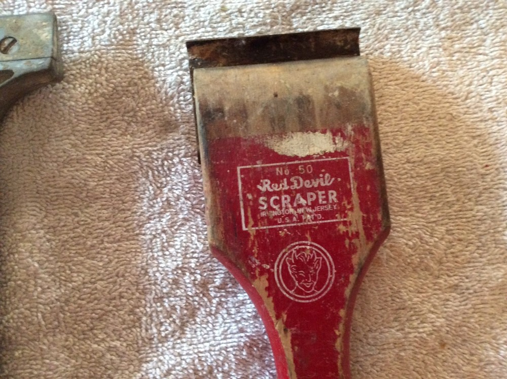 Three red Devil scraper tools