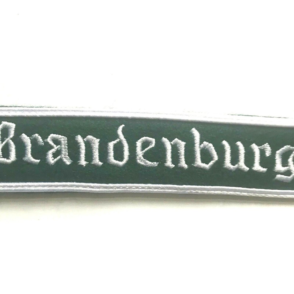 BRANDENBURG CUFF TITLE ON GREEN WOOL FOR ARM