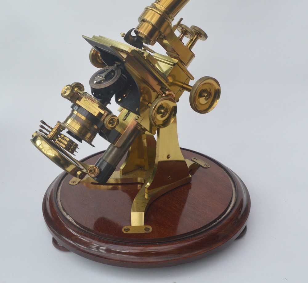 Very large binocular microscope in case with accessories.