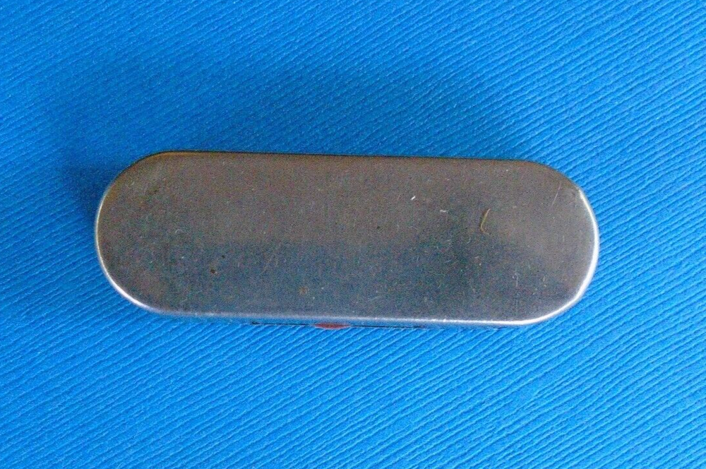 WWII home front ration token holder, made by Millgate, with some tokens