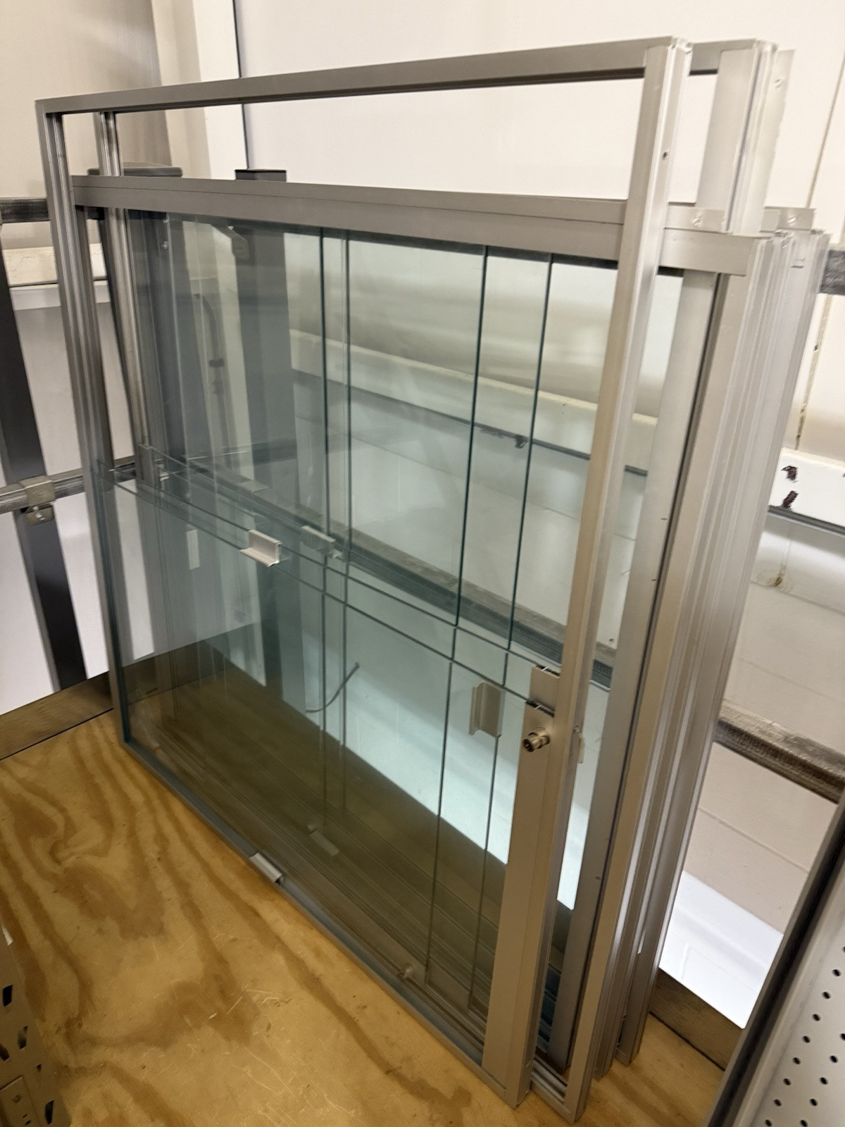 HUGE lot of pallets of Used Lozier Shelving shelves, components, glass cases