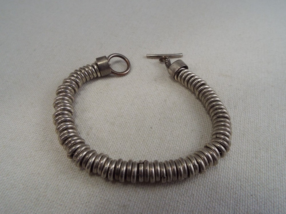 Silvertone Rings on a Chain Bracelet (C36)