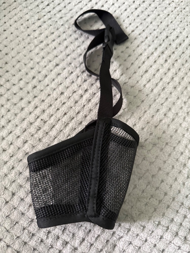 "Adjustable Black Mesh Muzzle for Dogs - Breathable and Comfortable Training Aid