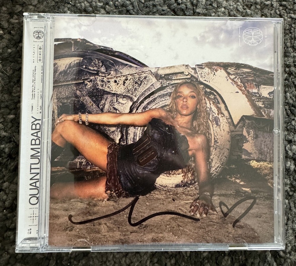 signed quantum baby cd - autographed by tinashe