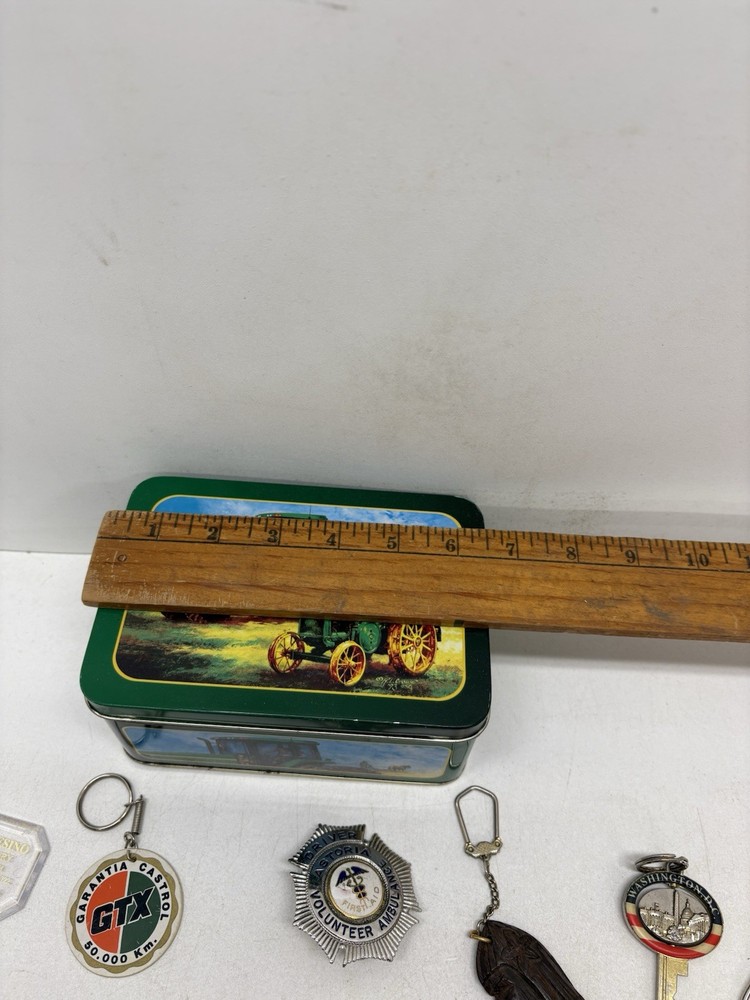32 Vintage Key Chains And a John Deere Tin Box