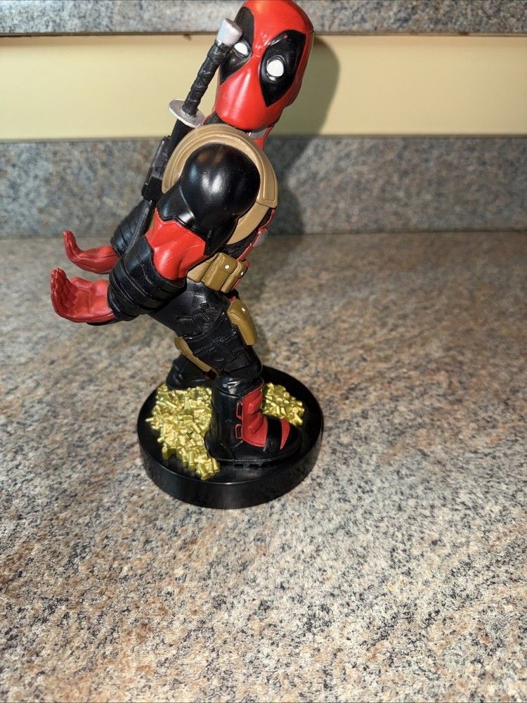 Deadpool controller/phone holder. Marvel Cableguys. Good shape. About 9 " High.